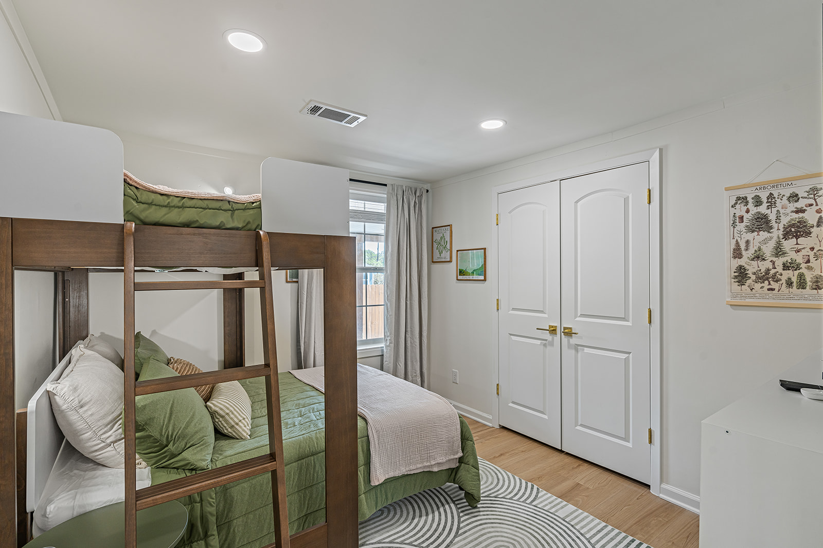 Downstairs bunk room with a twin-over-full bunk bed